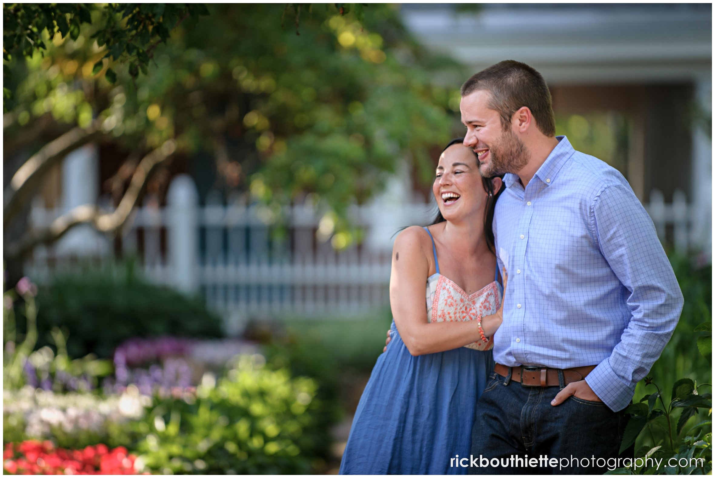 couple laughing during seacoast engagement session