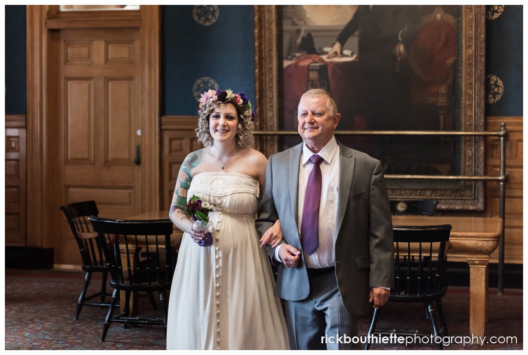 bride & father walking into lowell city hall wedding