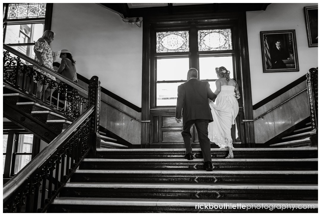 bride & father walking up stairs to lowell city hall wedding