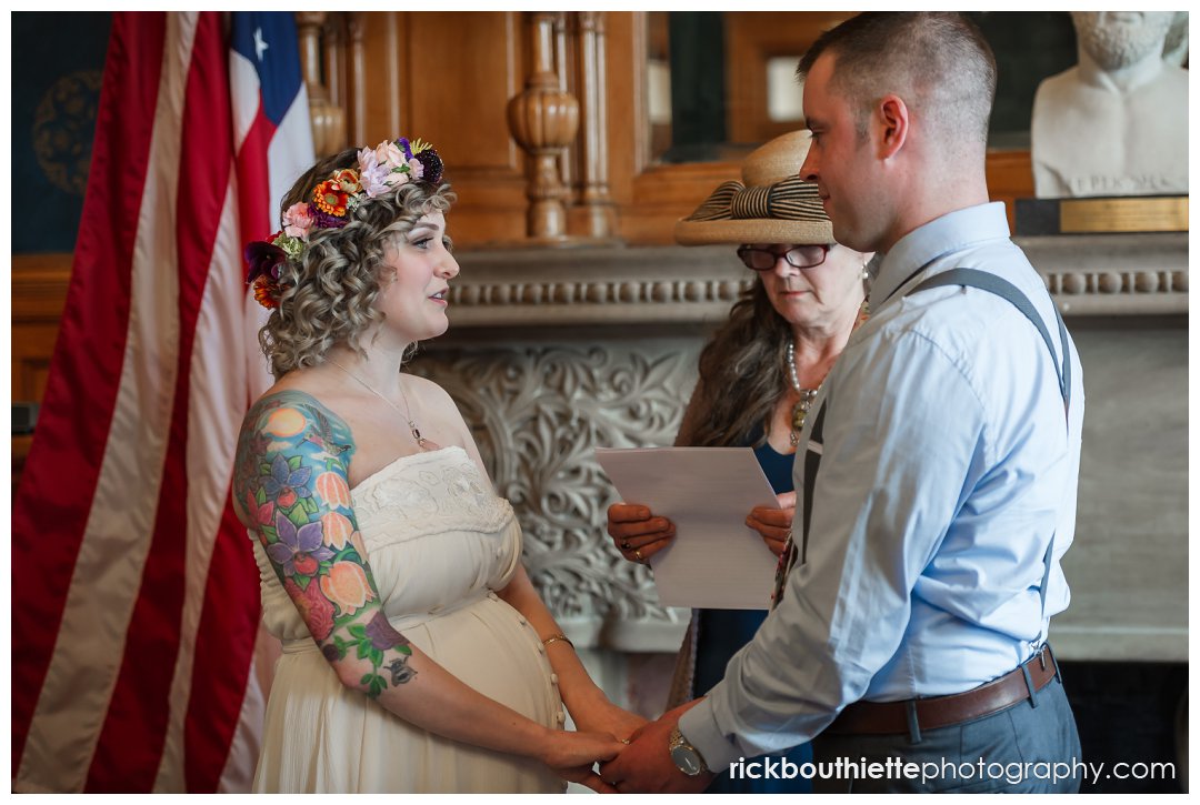 bride & groom exchange vows at lowell city hall wedding