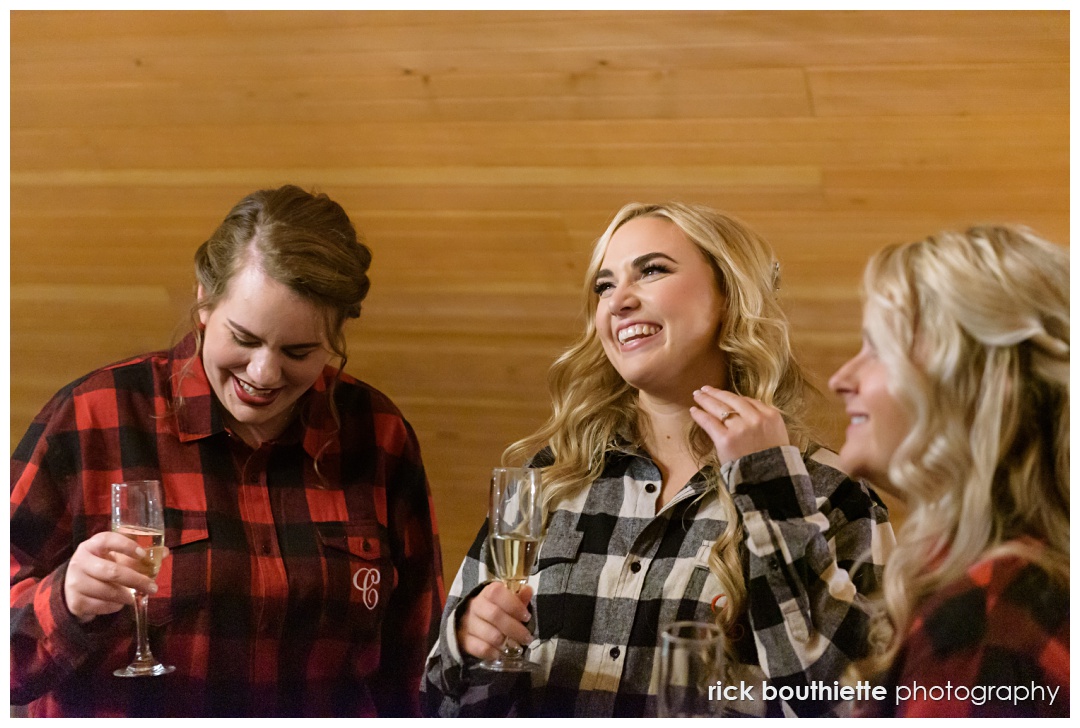 Bride and bridesmaids enjoying a glass of champagne before getting dressed for wedding at The Thompson Inn