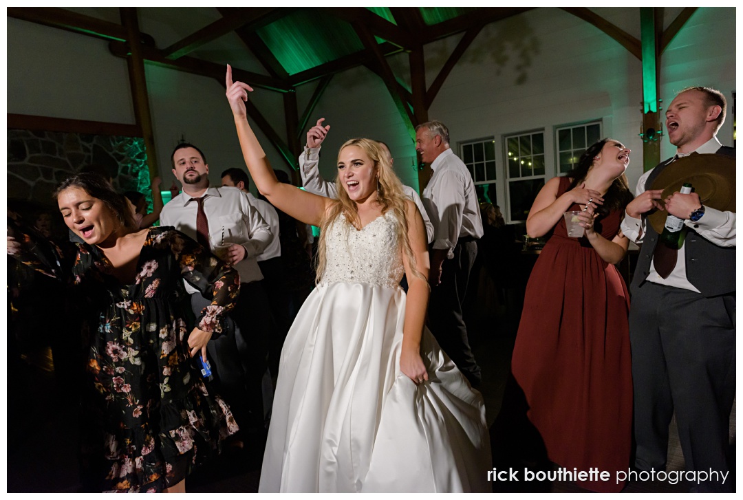 Bride dancing the night away with guests at The Thompson Inn
