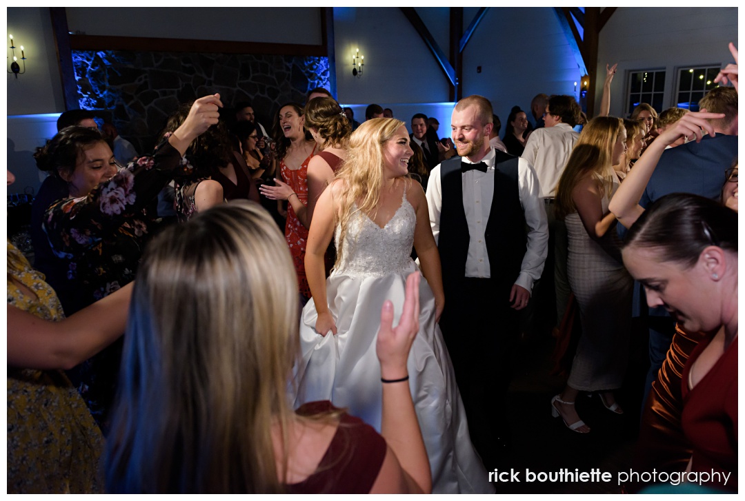 Bride and groom dancing the night away with guests at The Thompson Inn