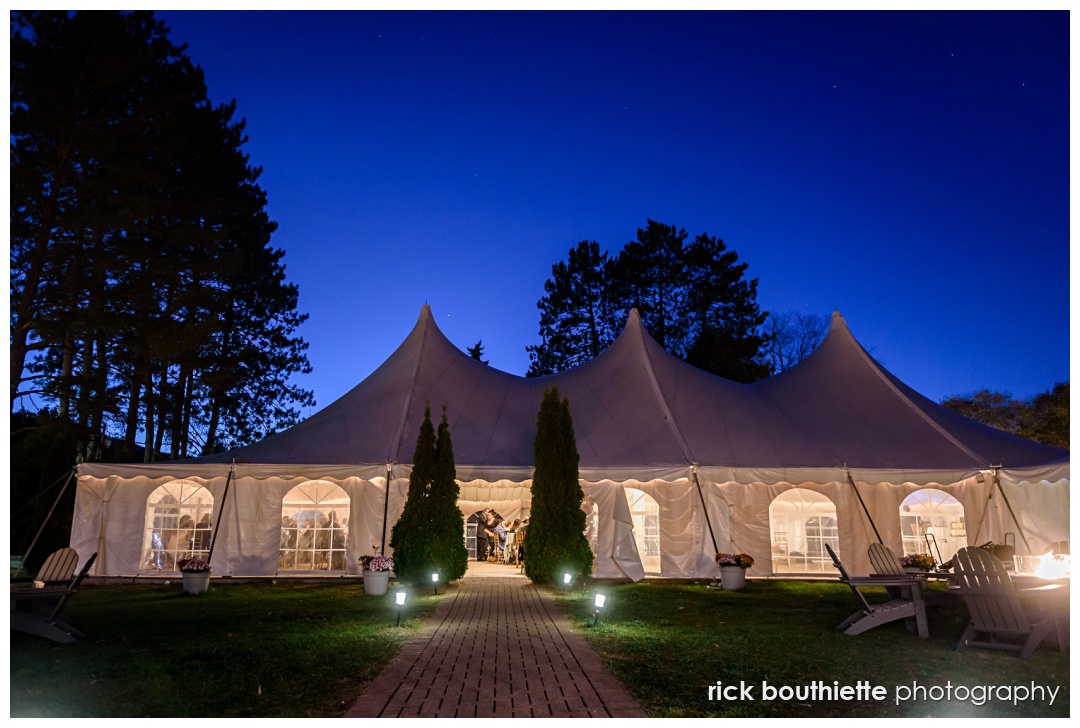 evening photo of the tent at Kasey & Jared's autumn wedding at The Wentworth Inn in Jackson, NH